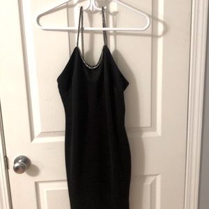 Black mini dress with diamond straps.